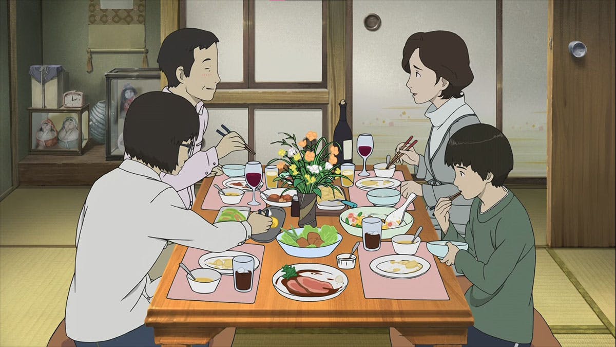 A heartwarming moment captured in the movie Colorful shows a family gathered around a dinner table, enjoying a meal with smiles on their faces, their warm and inviting gestures conveying a sense of love, unity, and shared moments of happiness.{caption: Source: Colorful (Movie)}